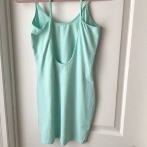 Turquoise body con, open back